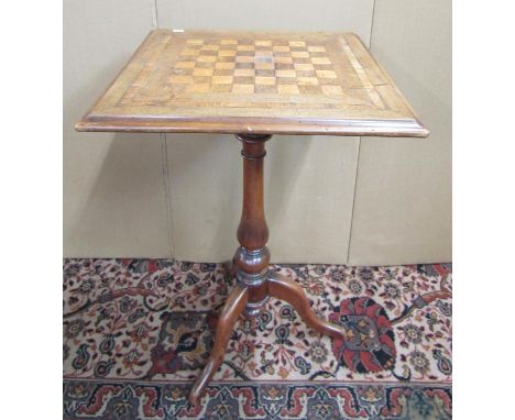 19th century mahogany games table of square cut form with chequer board inlay, raised on a vase shaped pillar and tripod, tog