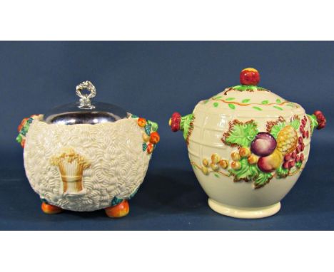 A Royal Staffordshire Pottery lidded biscuit jar decorated in relief with fruit, and a further lidded jar - Clarice Cliff Cel