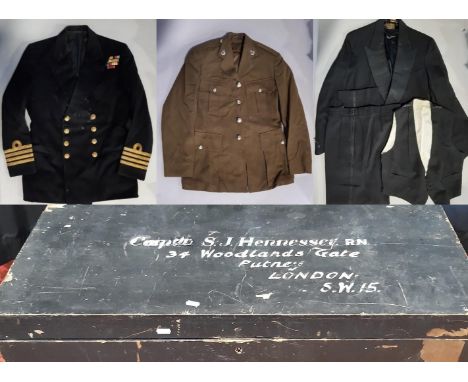 Wooden transport trunk containing the post war  Naval uniform of Captain SJ Hennessey  including Officers dress, dinner suits