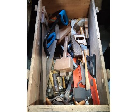 An ex military travelling trunk containing a good selection of hand tools mainly woodworking together with a contemporary upr