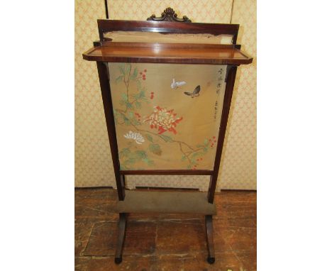 A small Georgian mahogany firescreen with rising panel and drop shelf raised on swept supports 