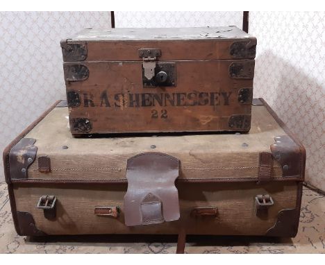 A vintage pine and steel banded tuck box and a further green canvas and leather bounded travelling trunk 