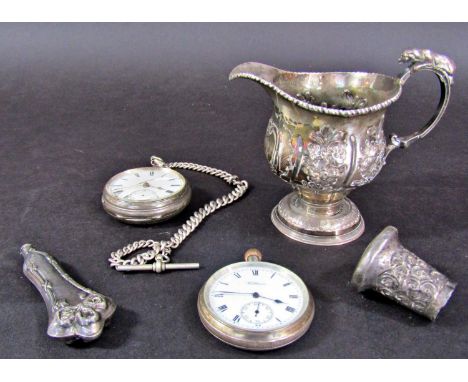 A George III silver floral engraved milk jug, the handle mounted with a dog, London 1762, maker William Cripps, together with