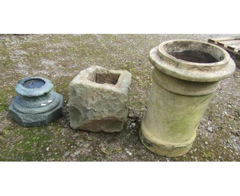 A rough hewn weathered natural stone planter/ex post support? 32cm square approximately, together with a reclaimed weathered 