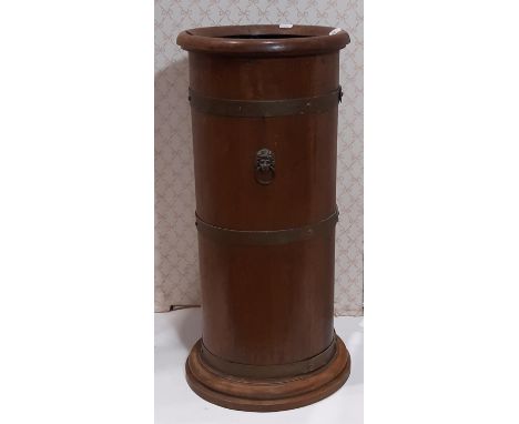 An Edwardian oak cylindrical stick stand, with coopered finish and lions mask handles, with zinc lined interior 