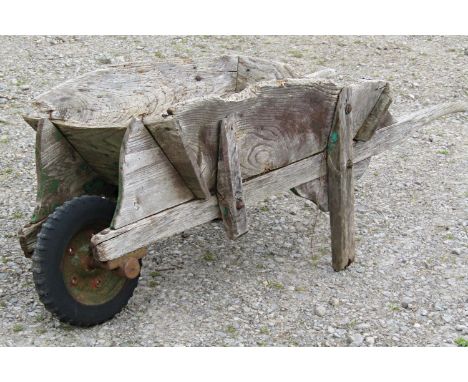 A weathered traditional elm wheelbarrow with possibly later replaced wheel (af) together with a small collection of vintage h