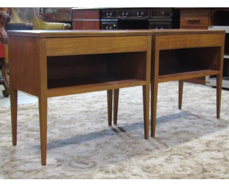 A pair of mid century teak side tables, each fitted with a frieze drawer on square tapered legs with under shelf, 31cm long x