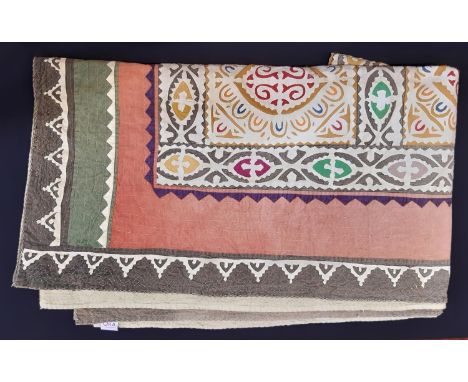 Large Indian style cotton throw by Oka with colourful geometric design of applique cutwork  on ivory ground, backed in light 