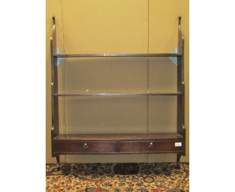 A Georgian mahogany wall shelf incorporating a pair of frieze drawers on shaped brackets, 81 cm wide 