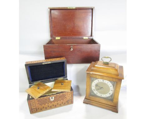 A 19th century parquetry inlaid tea caddy, an electrified wooden mantle clock, and a simple mahogany box. 