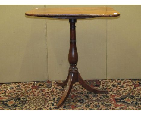 A Georgian mahogany occasional table with rectangular top, on a vase shaped pillar and swept base, 64cm max 