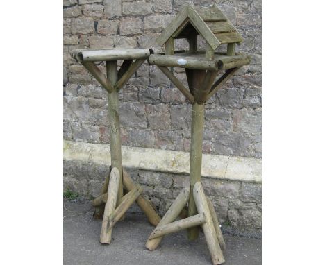 Two rustic wooden bird tables labelled Hutton (af) 