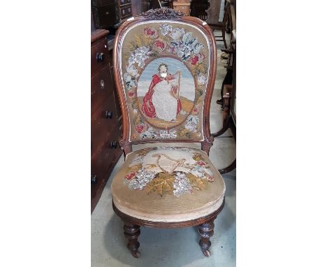 A Victorian drawing room chair with carved show wood frame, with original hand worked tapestry seat and back showing characte