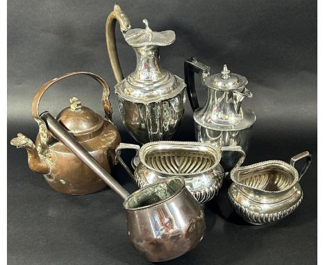 A silver plate ewer with hinged cover, silver plated coffee pot, sugar bowl and milk jug, a canteen of fish knives and forks,