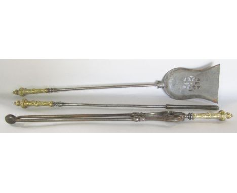 A good quality set of three Georgian fire tools, poker, tongs and shovel, cast iron with decorative engraved brass handles. 