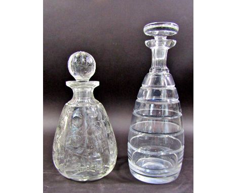 A modern Art Deco designed spirit decanter, with graduating grooves, another modern spirit decanter with etched foliate detai