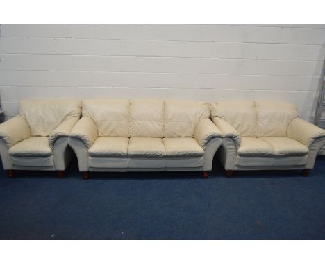 A CREAM LEATHER FOUR PIECE LOUNGE SUITE, comprising a three and a two seater settee, armchair and a pouffe (Sd to one leg) (4