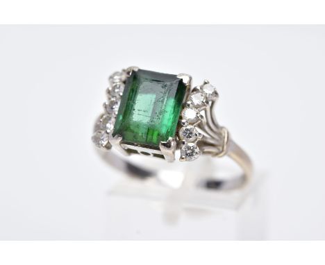 AN 18CT WHITE GOLD GREEN TOURMALINE AND DIAMOND RING, designed with a central, rectangular cut green tourmaline, approximate 