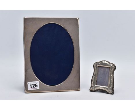 TWO SILVER FRAMES, the first of a plain polished rectangular form, with an oval aperture, hallmarked Sheffield 2003 'Francis 