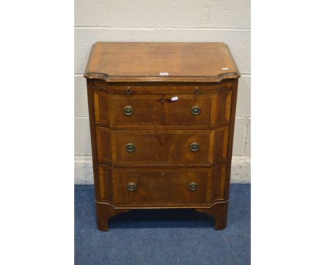 A REPRODUCTION MAHOGANY AND CROSSBANDED CHEST OF THREE GRADUATED DRAWERS, with concave front corners, brushing slide, on brac