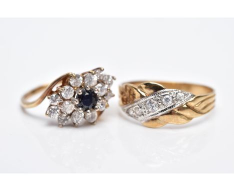 TWO 9CT GOLD GEMSET RINGS, to include a blue sapphire and colourless stone cluster ring of a marquise form, crossover shoulde