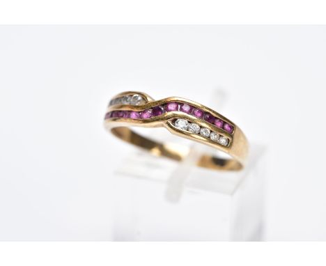 A 9CT GOLD RUBY AND DIAMOND RING, of an interlinking crossover design, set with a row of channel set circular cut rubies and 