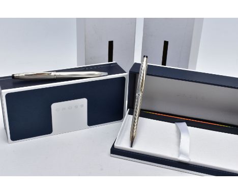 TWO CASED 'CROSS' BALL POINT PENS, each of an engine turn design, stamped 'Cross 925' silver cap/barrel, hallmarked London, b