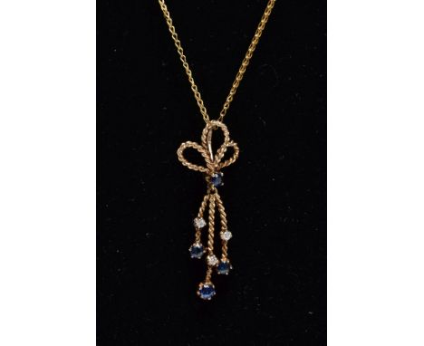 A 9CT GOLD SAPPHIRE AND DIAMOND PENDANT NECKLET, the pendant of a rope twist design set with a circular cut sapphire, suspend