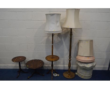 A BEECH STANDARD LAMP with a central circular tray, another standard lamp, two mahogany wine tables and eight lamp shades (Sd