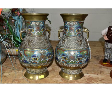 A PAIR OF CHINESE BRASS AND CHAMPLEVE TWIN HANDLED BALUSTER VASES, cast decoration, animal masks to handles, cast seals marks