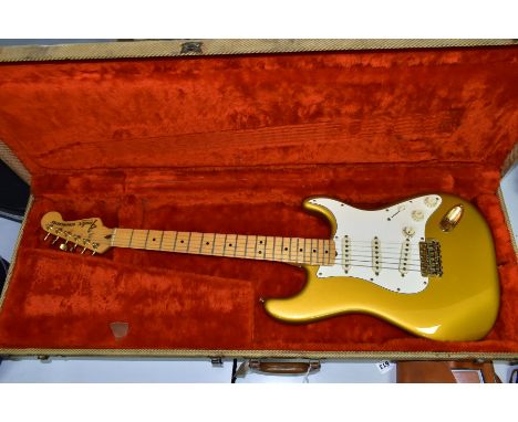 AN EARLY 1980'S USA FENDER STRATOCASTER GOLD ON GOLD, serial no CA11522, on a one piece maple neck and fingerboard (dated 178