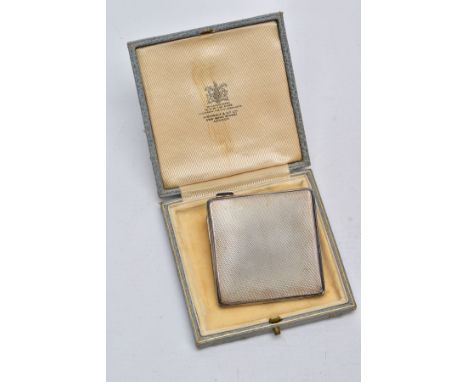 A SILVER COMPACT, square form with an engine turn design, hallmarked Birmingham 1945 'Adie Brothers Ltd', approximate dimensi