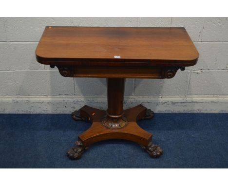 A VICTORIAN ROSEWOOD CARD TABLE, the fold over top enclosing a circular purple baize lining, on a cylindrical tapering suppor