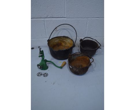 THREE VARIOUS IRON CAULDRONS with hooped handles, along with an enamel meat mincer (4)