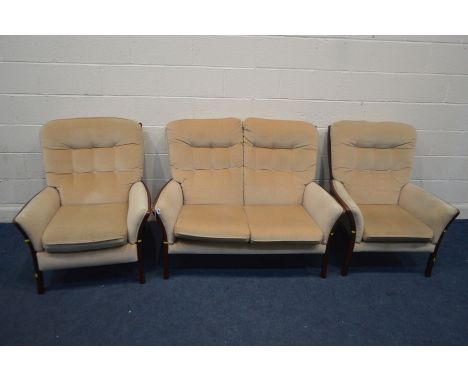 A CREAM UPHOLSTERED AND WOODEN FRAMED THREE PIECE SUITE, comprising a two seater settee, manual reclining armchair and anothe