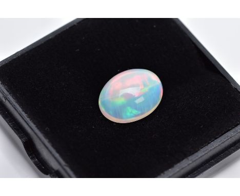 A LOOSE OPAL OVAL CABOCHON CUT STONE, measuring 12.5mm x 9.3mm, weighing approximately 3.30ct