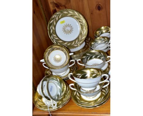 A COALPORT PART DINNER SERVICE, (UNNAMED) WITH GREEN AND GILT BORDER OF LEAVES, comprising seven dessert plates, five tea pla