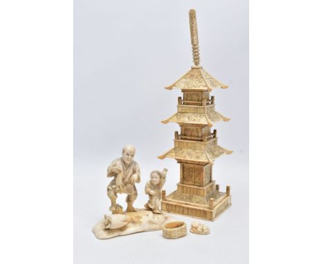 A LATE 19TH CENTURY JAPANESE IVORY OKIMONO OF A VEGETABLE VENDOR AND A YOUNG BOY MOUNTED ON A ROCKY BASE, accompanied by a ba