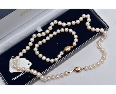 A CULTURED PEARL NECKLET AND MATCHING BRACELET, a strand of cultured pearls individually knotted on a white cord, each pearl 