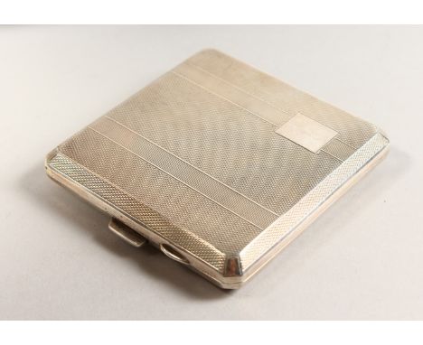 AN ENGINE TURNED SILVER CIGARETTE CASE. 8cms x 8cms.  Birmingham 1941.