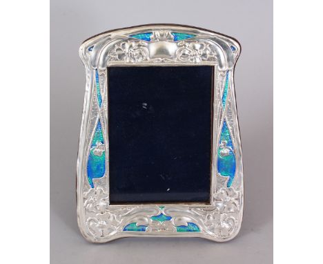AN ART NOUVEAU STYLE SILVER AND ENAMEL FRAME. 8.5ins x 6ins.
