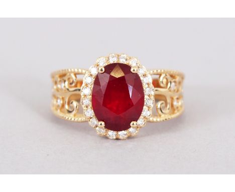 A 14CT YELLOW GOLD AND DIAMOND RING set with an oval cut ruby approx. 3.10cts. Diamonds approx. 0.30ct total weight.