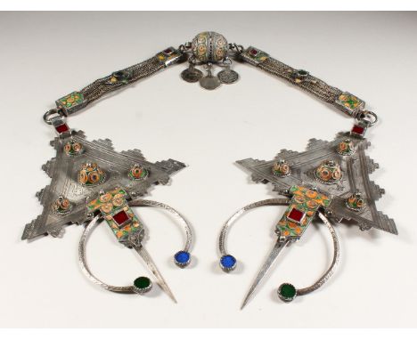 A VERY GOOD ISLAMIC SILVER PENDANT, 23ins long, set with semi-precious stones, coins and enamel.