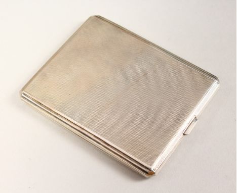 AN ENGINE TURNED SILVER CIGARETTE CASE. 10cms x 8cms.  London 1931.  Goldsmith &amp; Silversmith Co.