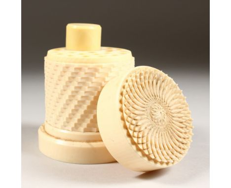 A GOOD EUROPEAN IVORY CIRCULAR CIGARETTE HOLDER AND LIGHTER, the screw off top carved with a chrysanthemum. 4ins high x 3.25i