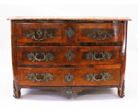 AN 18TH CENTURY FRENCH KINGWOOD COMMODE, slightly bowed form, with a rouge marble top, two short and two long drawers, all wi
