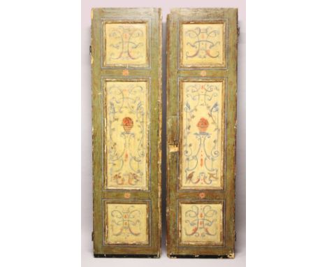 A PAIR OF DECORATIVELY PAINTED PINE PANEL DOORS. 7ft 3ins high x 2ft 0ins wide.