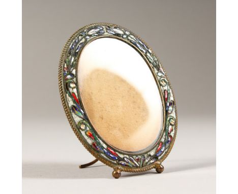 AN ITALIAN GILT METAL AND ENAMEL OVAL PHOTOGRAPH FRAME. 8cms x 6cms.