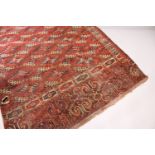 A LARGE BOKHARA CARPET. 10ft x 5ft 9ins.