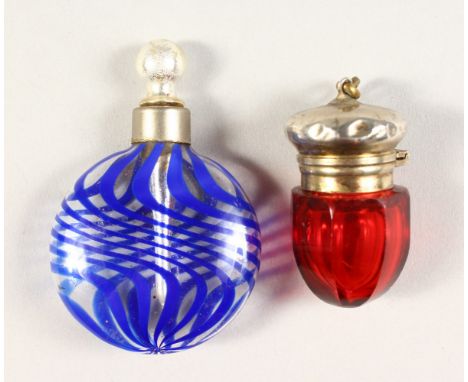 A SMALL VICTORIAN RUBY GLASS SILVER TOP SCENT BOTTLE and A BLUE SCENT BOTTLE.